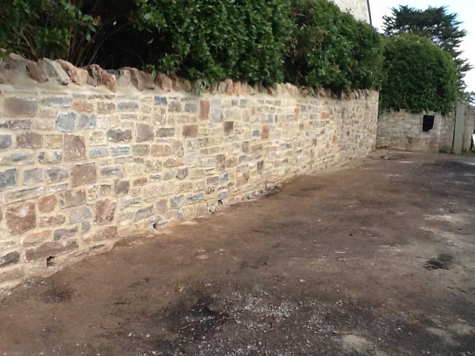 Grade II listed wall partially taken down.